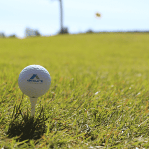 Absolute Home Mortgage golf ball on top of tee