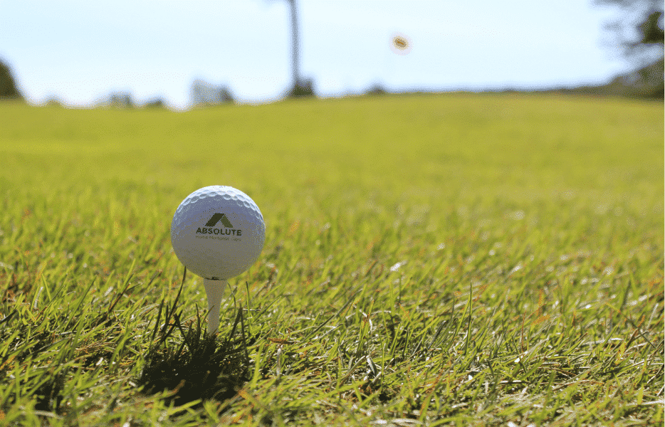 Absolute Home Mortgage golf ball on top of tee